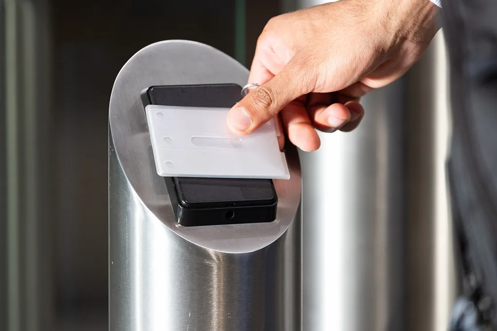 A barrier access control being opened via a key card