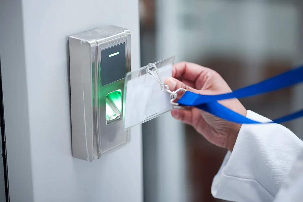 An access control key card being used to gain authorised entry