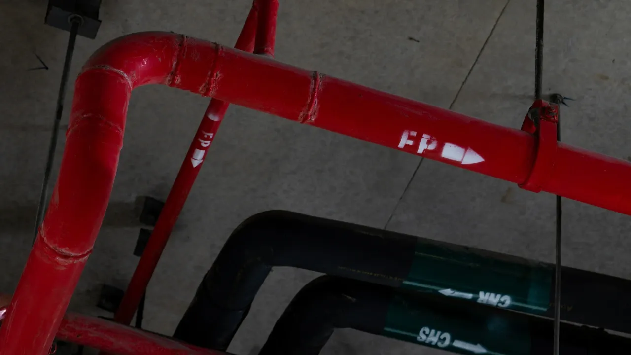 a network of red pipes attached to the ceiling