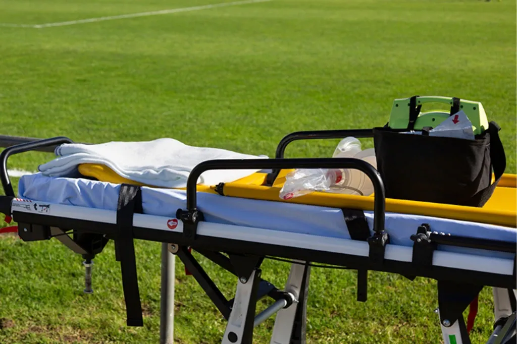 A first aiders stretcher on a football pitch
