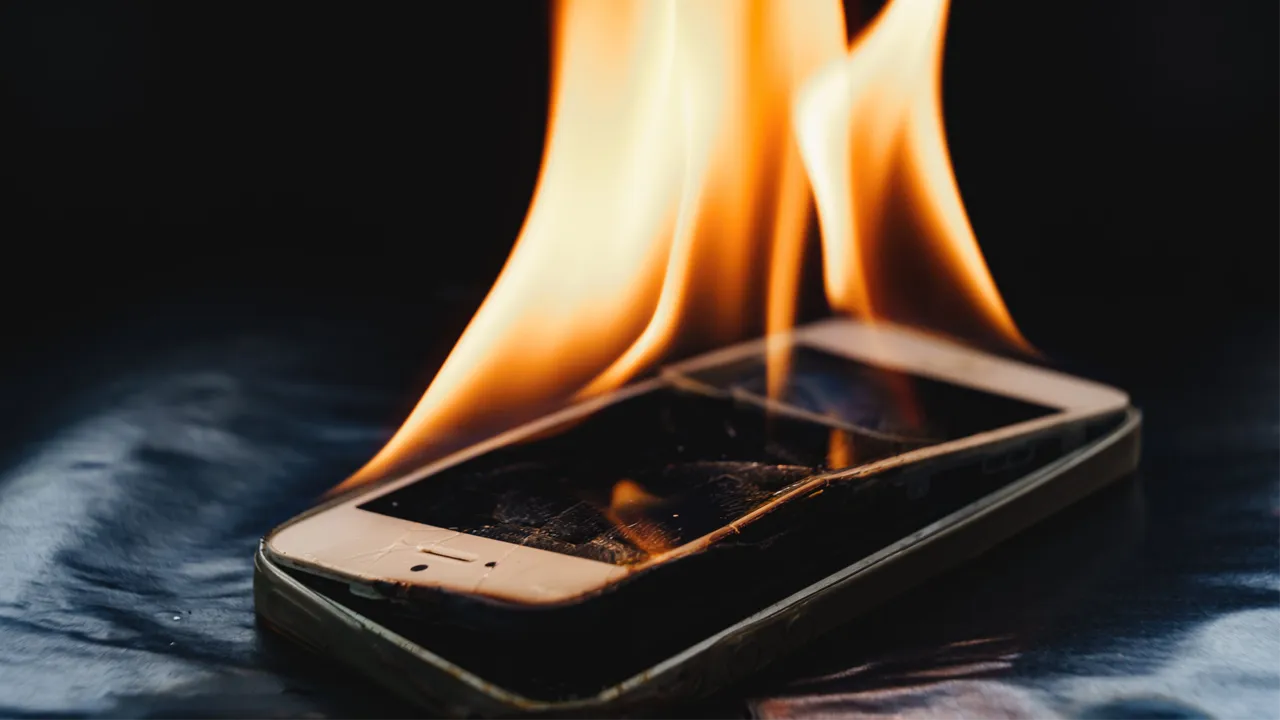 A phone burning in a Class L fire caused by thermal runaway