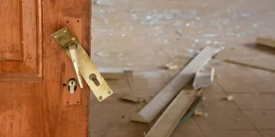 A broken door from a break in